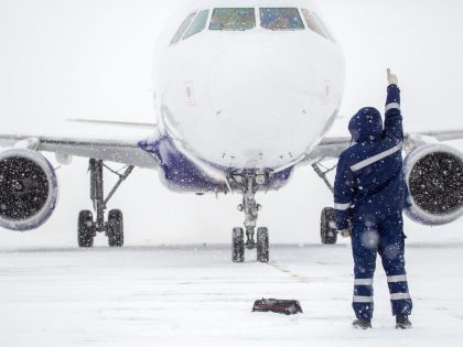 man and plane in snow 4x3 1